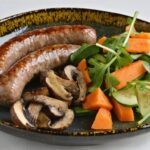 Les secrets pour magnifier une andouillette avec des accompagnements savoureux