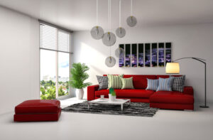 Salon moderne avec canapé rouge et intérieur lumineux.